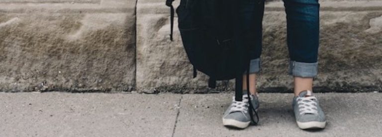 Person's feet with bag